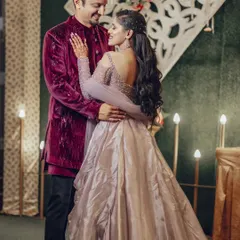 A romantic embrace during the Sangeet. The soft lighting and the couple's loving gaze make this a perfect shot of their evening celebration.