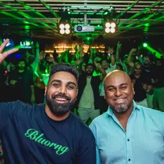 Me and DJ Jonas getting the crowd hyped at Gawky Goose. Our back-to-back sets are legendary for Saturday nights.
