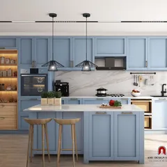 Another view of the blue kitchen concept, highlighting the ample storage, marble backsplash, and modern pendant lighting over the island.