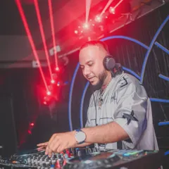 Another shot of me working the turntables under the red lights. The atmosphere has to be right to get people in the zone for some classic hip hop.