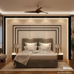 This bedroom design is a masterclass in neutral elegance. The layered headboard with black metal accents, warm wood flooring, and soft ambient lighting create a sophisticated and tranquil retreat.