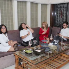 This is what a successful house party looks like. Guests relaxing and laughing over drinks, without the host having to worry about a thing. That's the service we provide.