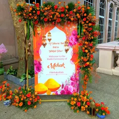 The welcome sign for this "Turmeric Tale" was designed to be as vibrant as the event itself. Framed in a cascade of orange marigolds, it set the perfect festive tone for a Turkish-themed Haldi.