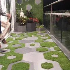 For this balcony makeover, I used a creative combination of hexagonal tiles and artificial grass patches. It’s a modern, playful design that adds texture and greenery while being easy to maintain.