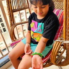 Little Vidita admiring her new bangle. I made this piece to be light and comfortable for small wrists, while still being full of character.