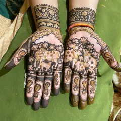 I love exploring unique art styles, and this Pichwai-inspired mehndi is a personal favorite. The design centers around cow and calf motifs, which are sacred and traditional, blended with delicate floral patterns for a distinctive look.