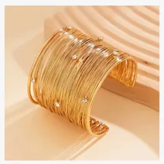 A clean, angled shot of the statement mesh cuff bangle, showing the delicate crystals embedded in the wire.