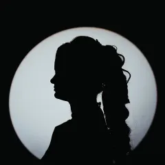 A simple yet powerful silhouette portrait of a bride, using a single light source to create a graphic and timeless image.