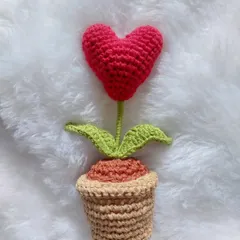This is my Heart Pot amigurumi, a sweet little potted plant with a heart-shaped flower. It's the perfect desk buddy to brighten your day.