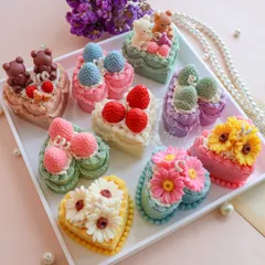 My collection of heart-shaped cake candles is perfect for making birthdays and baby showers extra special. This tray shows the variety of designs, from teddy bears and strawberries to delicate flowers.