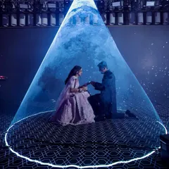 A truly magical proposal moment during the Sangeet, with the couple illuminated by a single spotlight under a ceiling of thousands of blue LED lights, creating the illusion of a starry night sky.