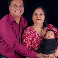 The pride and joy of grandparents holding their newborn grandchild. These multi-generational photos are precious heirlooms for the entire family.