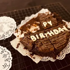 A perfectly imperfect shot of our "Happy Birthday" brownie cake after the first few delicious slices have been enjoyed.