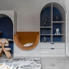 A wider view of the activity room, showcasing the built-in shelving within the arch. This area provides space for books and decor, while the plush, curved seating offers a comfortable spot to unwind.