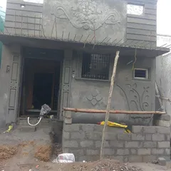 A full view of a completed house elevation, showcasing a prominent Ganesha mural. This image demonstrates how my work can define the entire character and curb appeal of a home.