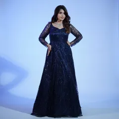 Another look at the full silhouette of our sparkling navy blue gown. The A-line cut is flattering on everyone and perfect for a formal evening event.