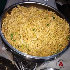 A large serving of our Veg Hakka Noodles, ready for a buffet line. We prepare our noodles fresh on-site to ensure they are served hot and have the perfect texture for your guests to enjoy.