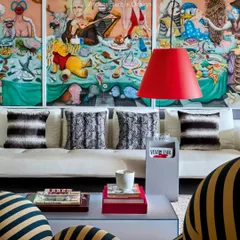 A closer look at the living room in Project 86. We paired a formal B&B Italia couch with a wild piece of art by Siddhartha Kararwal to create a space that’s both relaxed and full of personality.