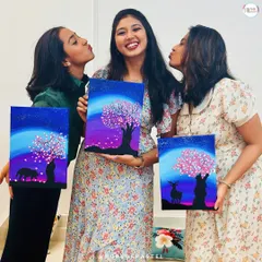 Three best friends celebrating their bond by creating beautiful canvas paintings together. A perfect idea for a creative get-together.