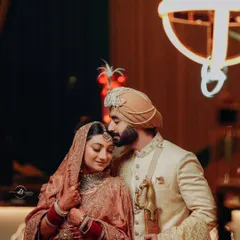 A tender moment between the bride and groom. The bride's soft makeup look enhances her natural beauty, creating a romantic and timeless image.