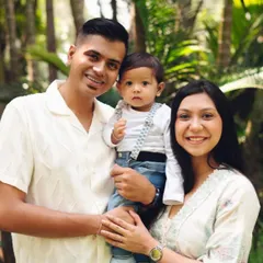 This portrait shows the joy and pride of a family of three. I guide my clients into natural poses that feel comfortable and look authentic.