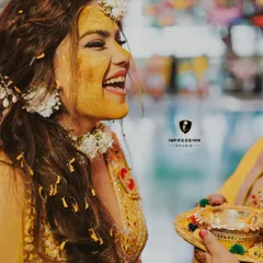 Haldi suits her! The bride's face is covered in turmeric, and her laugh is infectious. A perfect candid moment from a fun haldi ceremony in Bhimtal.