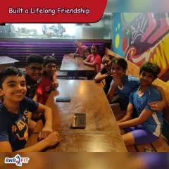 The bonds formed in the gym often turn into lifelong friendships. Here, our gymnasts are enjoying a meal together, strengthening their connection as a team.