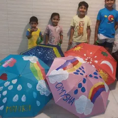 Look at these proud little artists with their hand-painted umbrellas. We provide the canvas and the colors, and they bring the magic, turning everyday objects into personalized masterpieces.