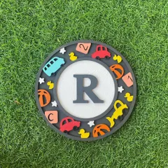 Beep beep! This monogram kit with the letter 'R' is perfect for little ones who love all things that go. It's decorated with cars, ducks, and alphabet blocks for a playful touch.
