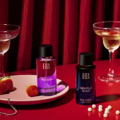 This romantic setup for a perfume campaign features strawberries, pearls, and champagne glasses against a rich, red-draped background. Every detail was curated to bring out an essence of luxury and celebration.