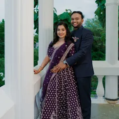 A happy couple portrait. The bride's makeup is fresh and bright, designed to look great in outdoor and indoor lighting.