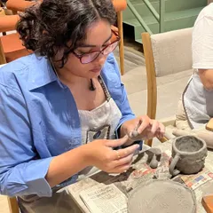 A moment of concentration during a hand-building session at one of our pop-up workshops. It's a chance to escape the noise and enter the clay.