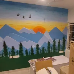 A peaceful mountain landscape mural painted at sunset, bringing a sense of natural tranquility and open space into the room.