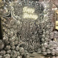 This is how we do party-varty. A full-scale glam setup featuring a silver sequin shimmer wall, custom neon sign, and a massive organic balloon garland. This isn't just a backdrop; it's the main event.