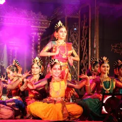 The full ensemble of dancers in a grand formation for the "Nava Durga" production. The variety of colors in their costumes represents the different forms of the Goddess.