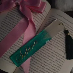This custom bookmark for 'Sakina' is styled with a book and ribbon. The deep green and gold combination is very elegant.