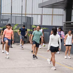 It all starts with a proper warm-up. Our coach leads the group through dynamic stretches before we hit the pavement for our Cubbon Park run.