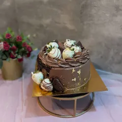 Another angle of the Belgian Chocolate and Strawberry cake, this time with white chocolate dipped strawberries and a sprinkle of gold leaf for extra elegance.