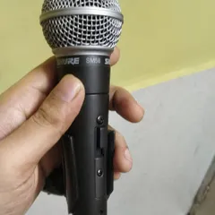Good equipment is important for a quality recording. This is my Shure SM58 microphone, a reliable industry standard that helps me capture clear, warm vocals for every custom song project.