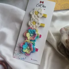 A set of our floral crochet clips, featuring multi-color and daisy designs. These are perfect for adding a touch of nature to your look.