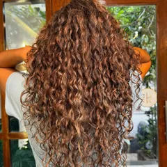Another shot of these gorgeous, blended grey curls, showing off their health and shine.