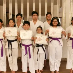 A group of my senior students at the Virar branch, proudly displaying their certificates. These black and purple belt holders are role models for our newer members.