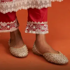A closer look at the Nutan Gold Vegan Jutti. The delicate pearl and zardozi work creates a quilted pattern, making this pair a sophisticated and elegant choice for any wedding or festive occasion.