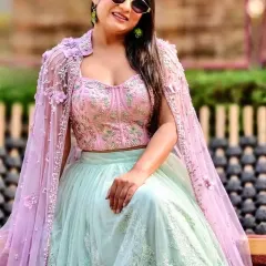 A pastel-themed look for a Mehendi carnival at JP Hotel, Mussoorie. The soft colors and intricate embroidery of the lehenga were perfect for a daytime event in the hills.
