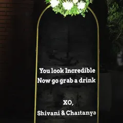 A cheeky and fun sign at the bar: "You look Incredible, Now go grab a drink." It's these small details that make guests feel welcome and ready to celebrate.