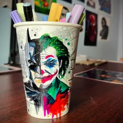 A unique commission turning a simple coffee cup into a canvas for a Batman and Joker mashup. This shows how we can get creative and make art on almost any surface you can imagine.