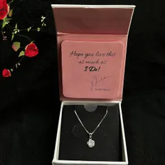 Unboxing a beautiful silver necklace from GIVA. This shot captures the excitement of receiving a special piece of jewelry, perfect for gifting campaigns.