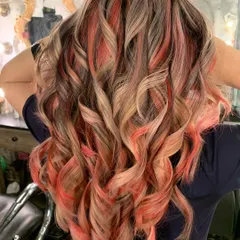 Peach fuzz perfection after a color correction. This client had Holi color deposited on her bleached hair, and we corrected it to this beautiful peachy, creamy mix.