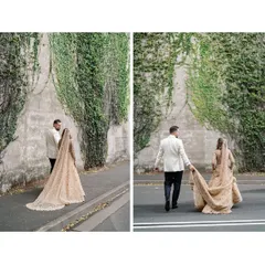 The groom helps with the bride's stunning floor-sweeping veil. This custom look was fully embellished and designed to be a one-of-a-kind statement of luxury and timeless beauty.