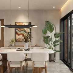 Another view of the modern dining room, highlighting the sleek black pendant light and the way natural light fills the space from the adjacent courtyard.